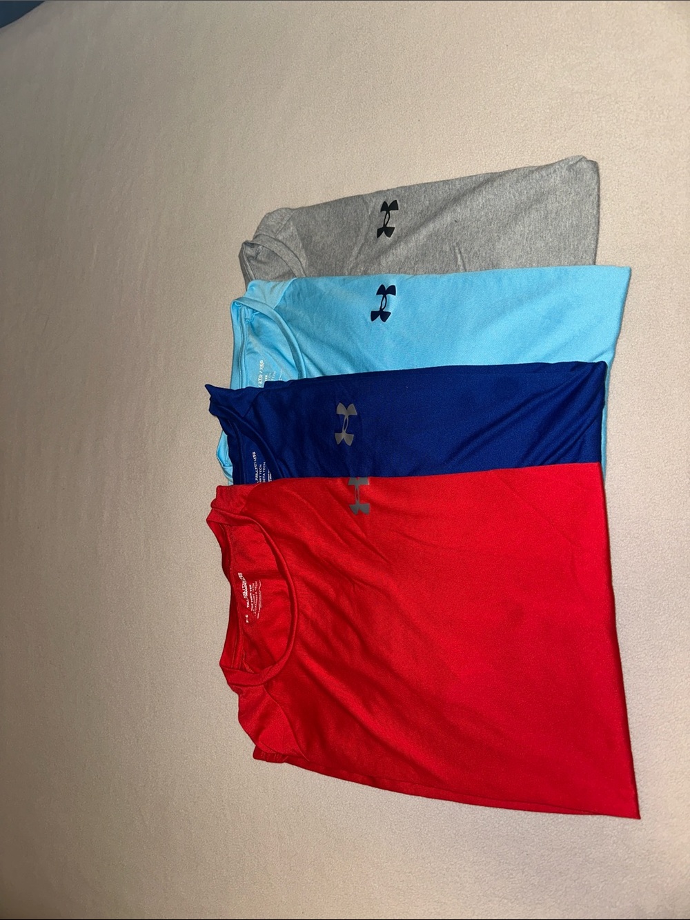 Under Armour Men's Short Sleeve Tees - Red, Blue, Gray and Light Blue.